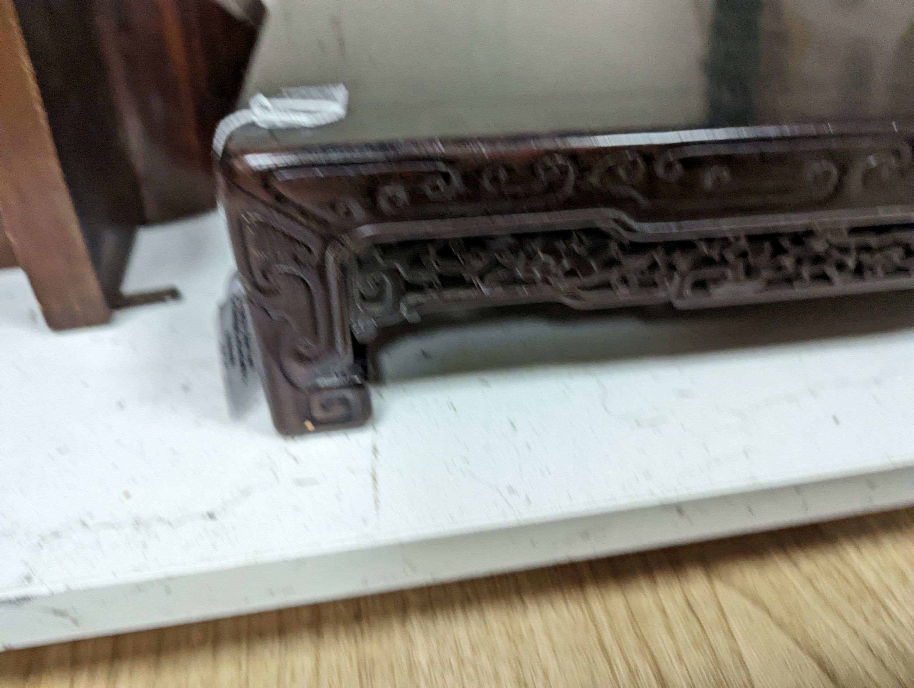 A 19th century Chinese hongmu low stand - 51cm long